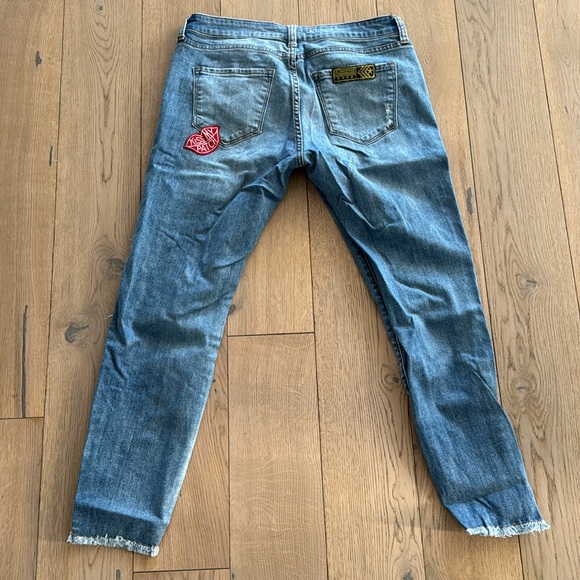 The cutest assorted patched jeans. Jeans have designer made holes for style. - Picture 2 of 5